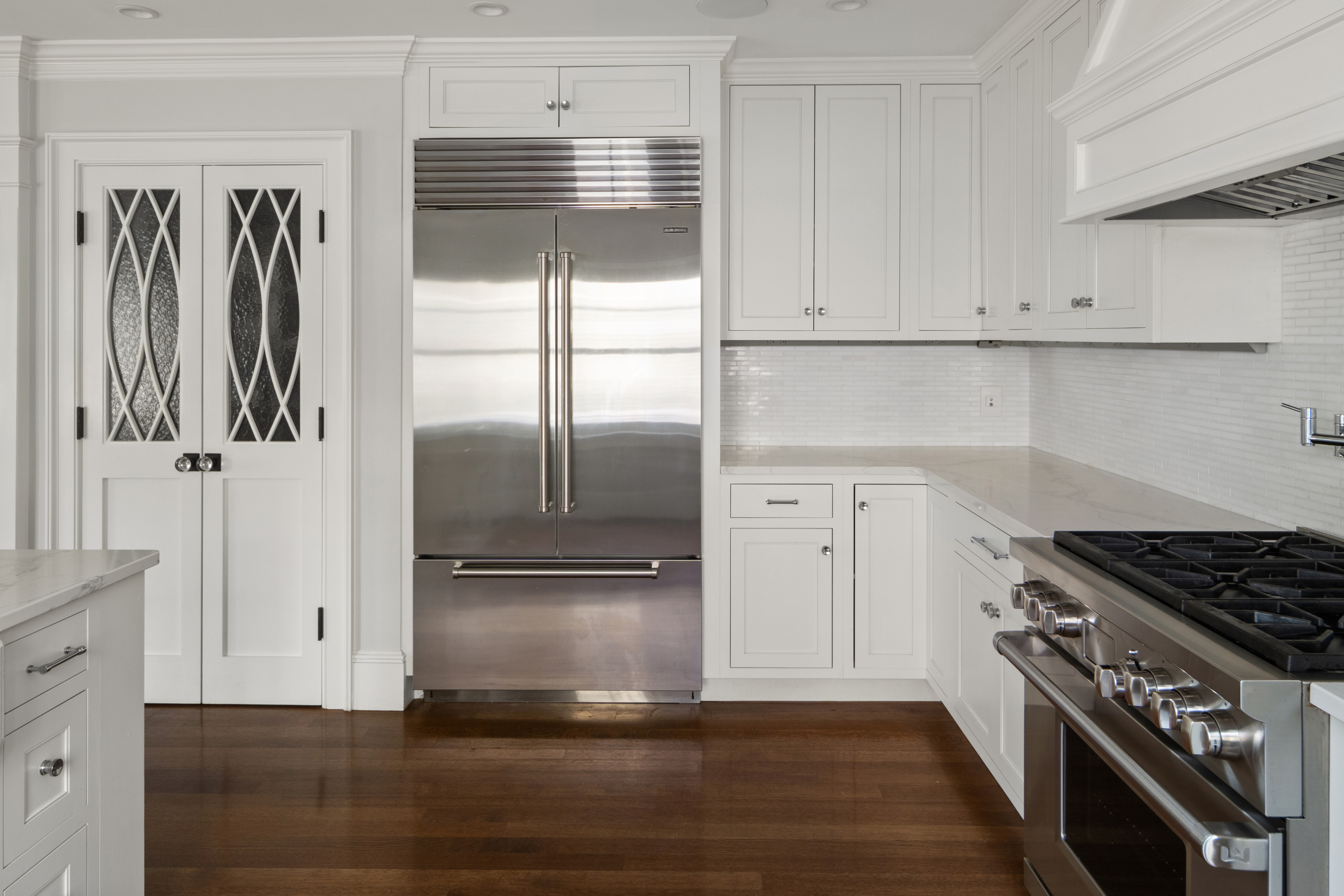 35 Willard Street Cambridge, MA 02138 - Photo 4 of 36 a kitchen with granite countertop a refrigerator and a stove top oven