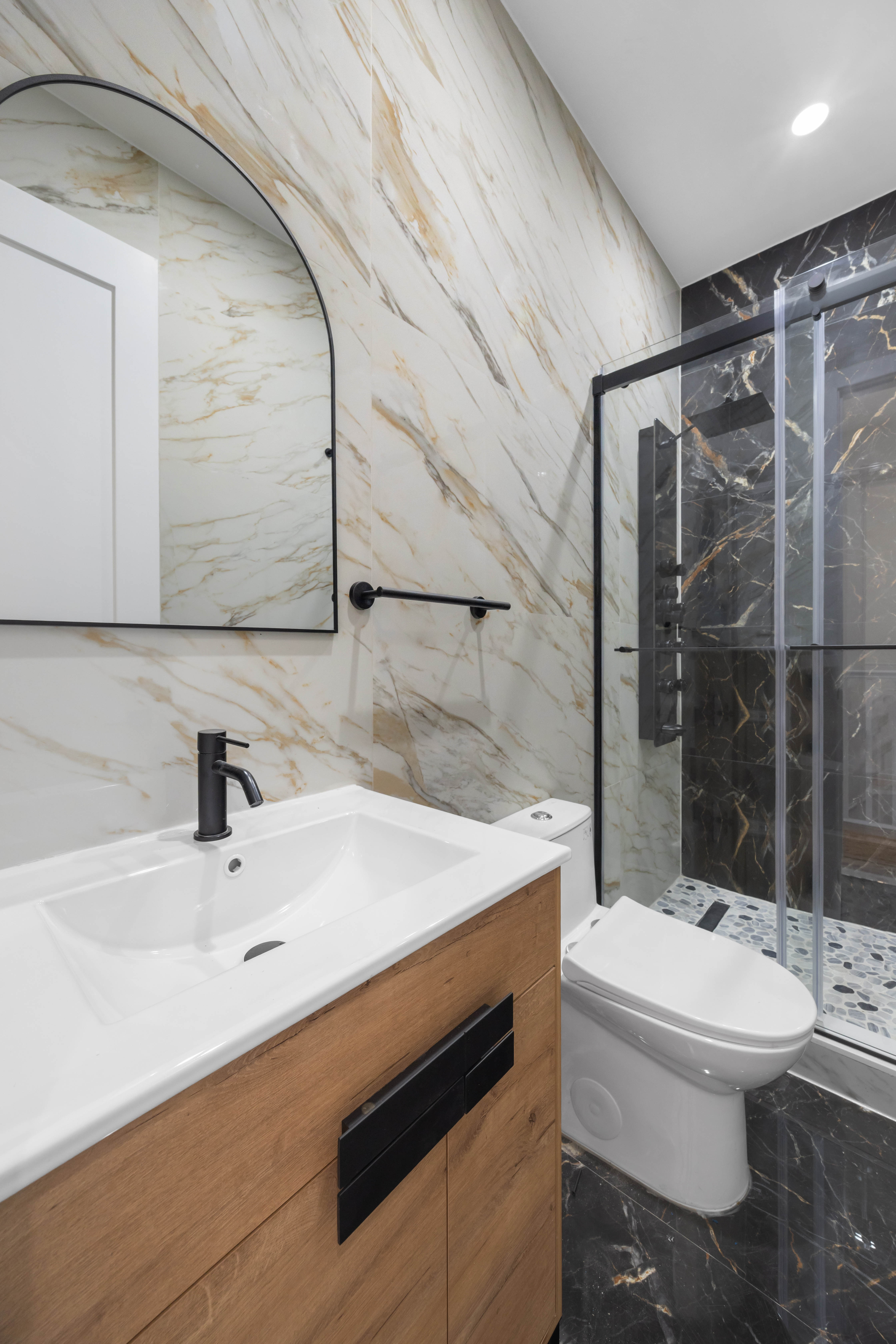 1000 Putnam Avenue Brooklyn, NY 11221 - Photo 9 of 17 a bathroom with a sink toilet and shower