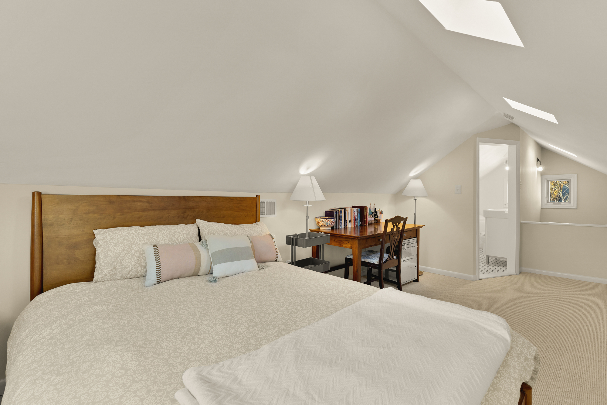 6815 Delaware Street Chevy Chase, MD 20815 - Photo 20 of 34 a bedroom with a bed and a chandelier