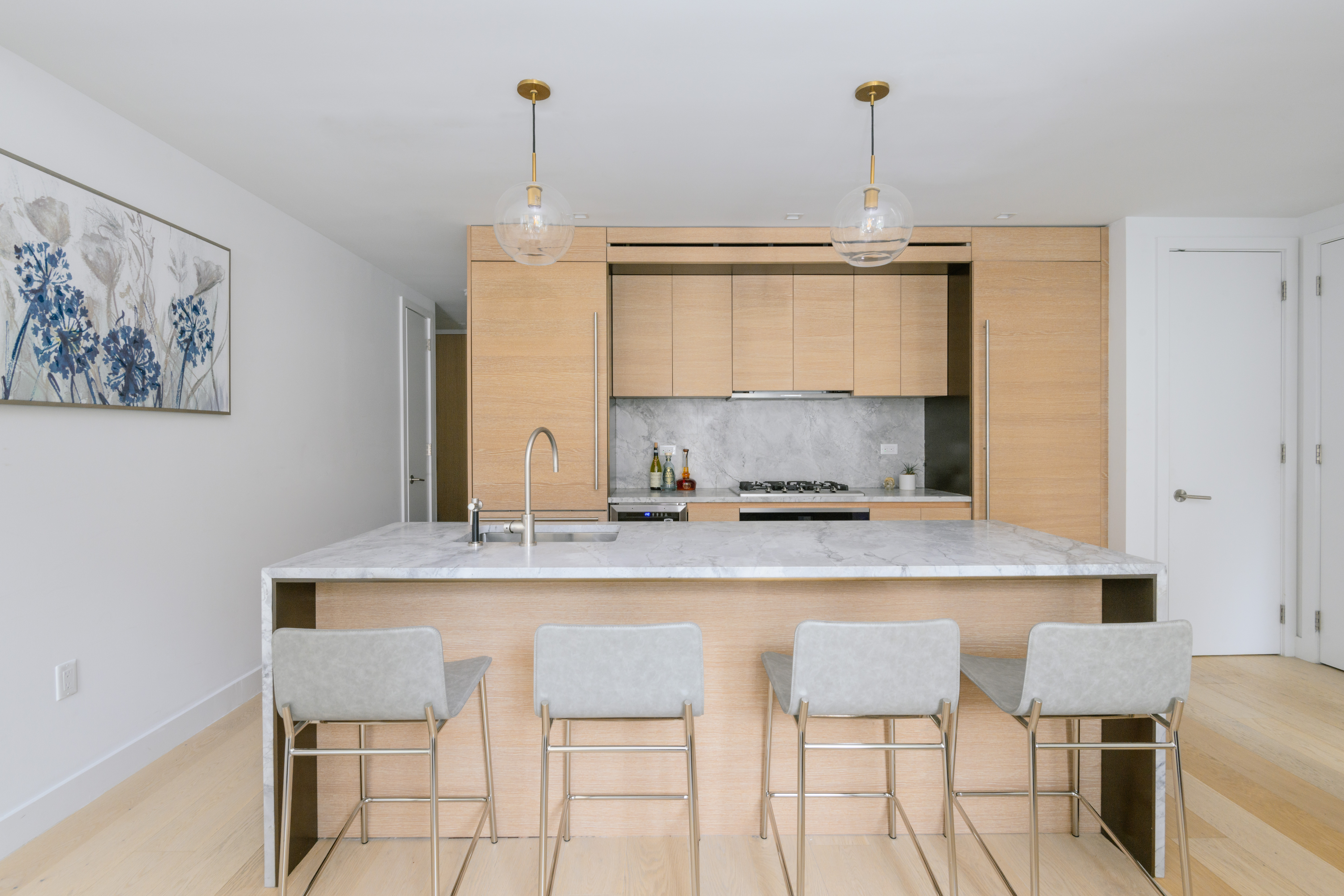 215 West 28th Street, Unit 4E Manhattan, NY 10001 - Photo 2 of 13 a kitchen with a table and chairs in it