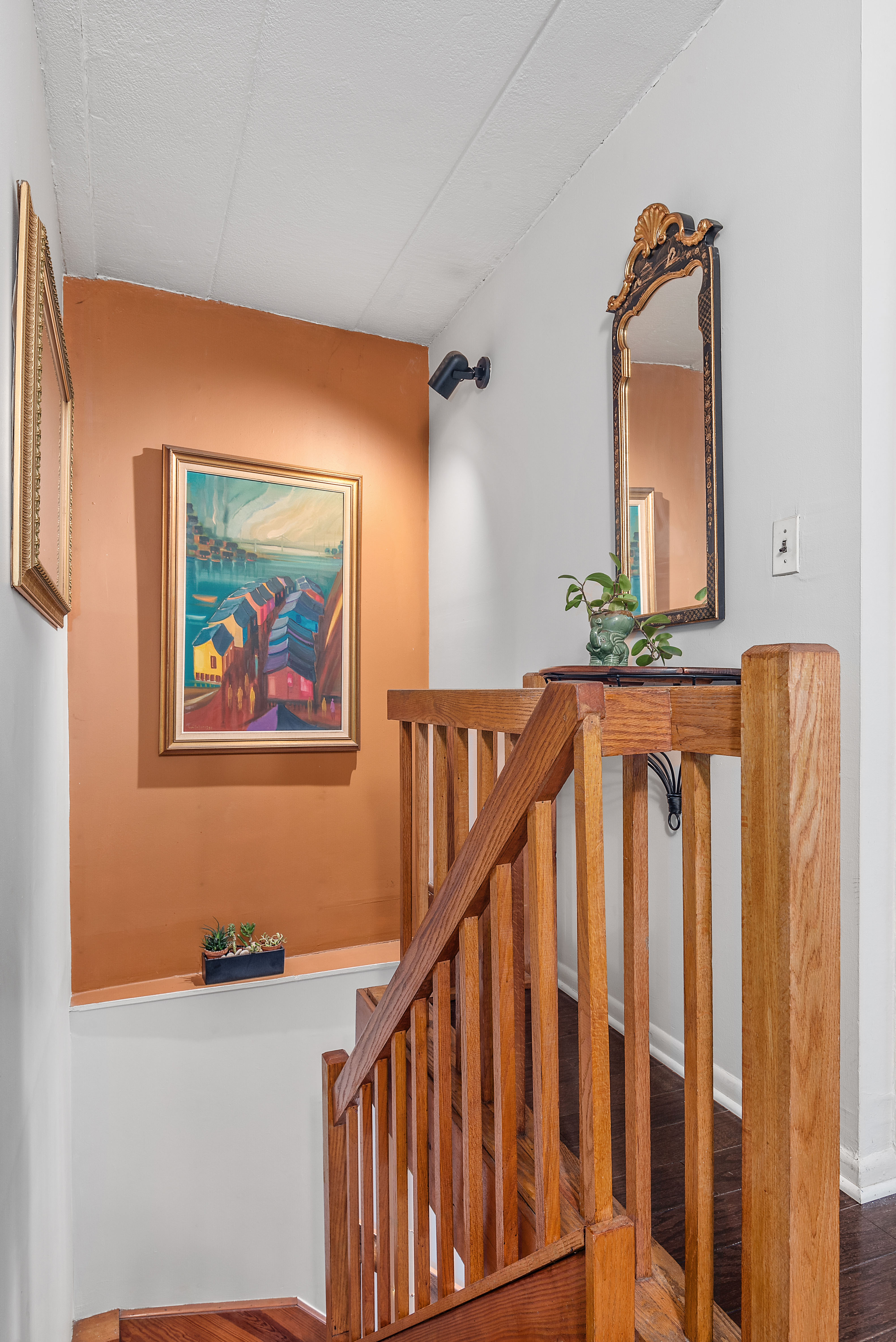 9951 Shore Road, Unit 1B Brooklyn, NY 11209 - Photo 4 of 9 a view of a hallway with wooden floor and staircase