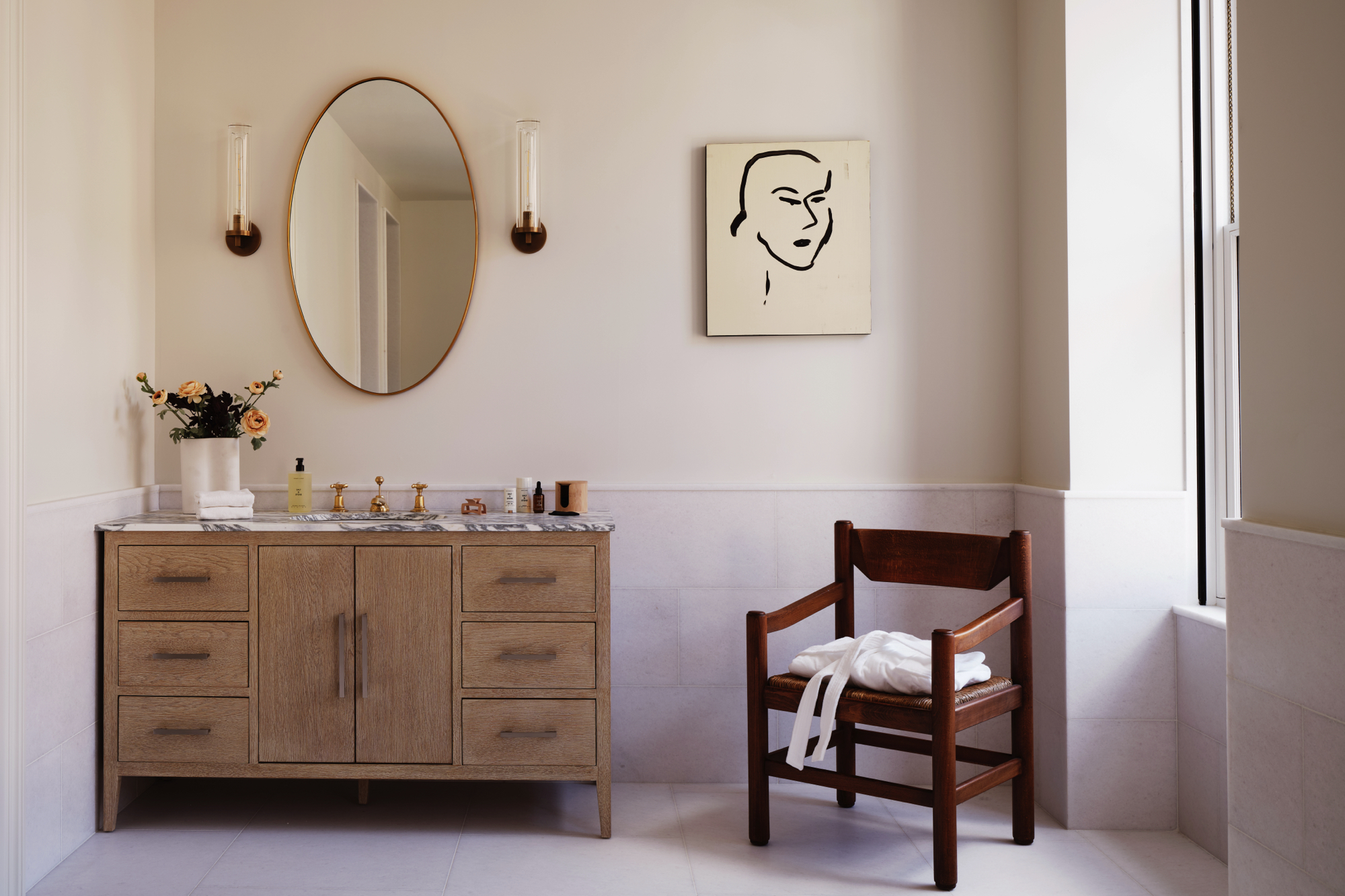 48-50 West 69th Street Manhattan, NY 10023 - Photo 15 of 33 a bathroom with a sink and a mirror