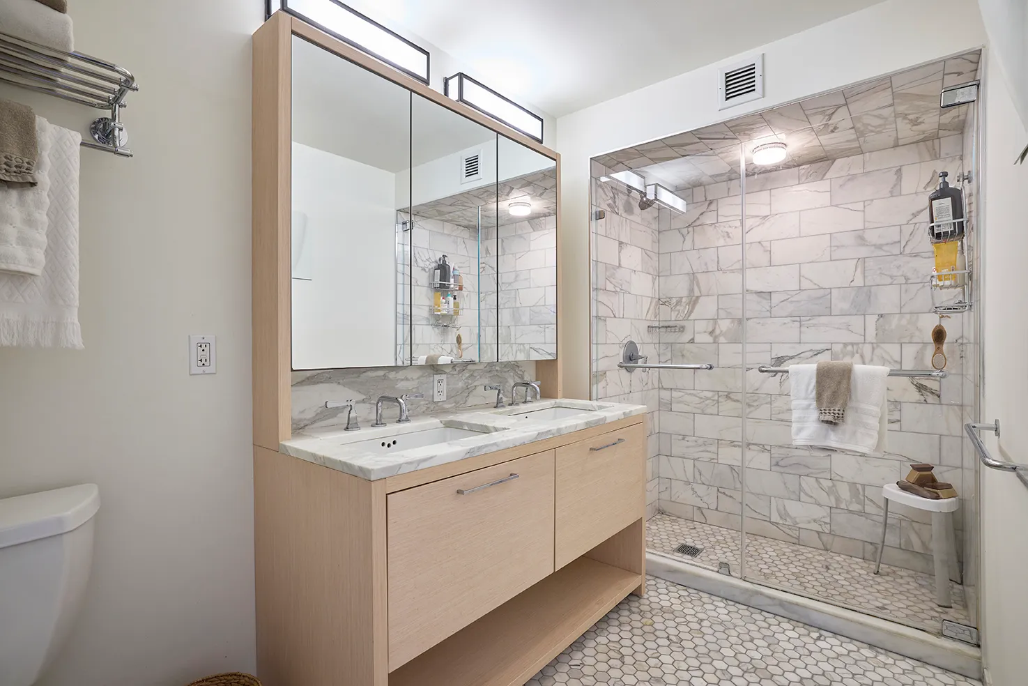 a bathroom with a granite countertop sink a shower and a mirror