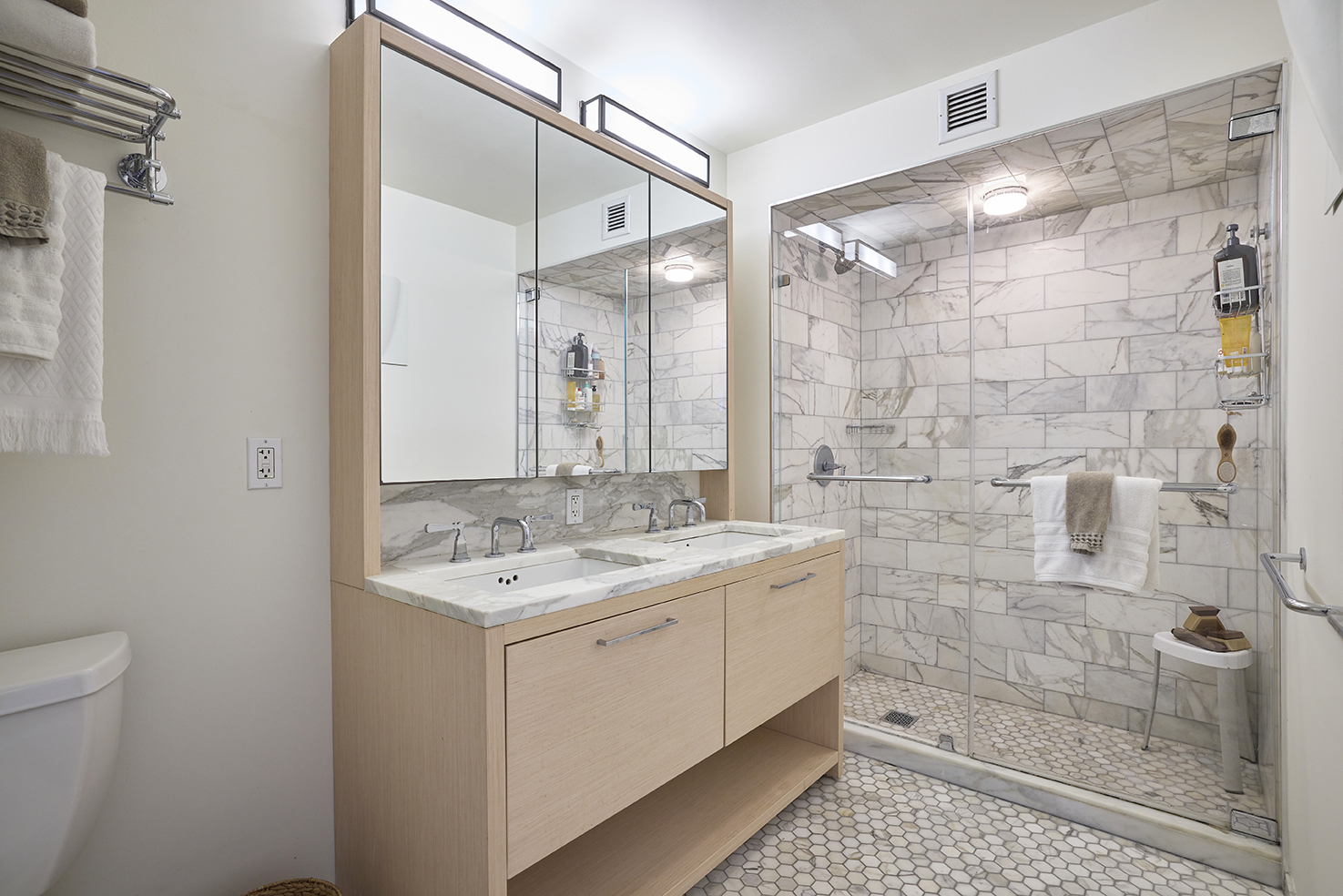 101 West 87th Street, Unit 205 Manhattan, NY 10024 - Photo 5 of 14 a bathroom with a granite countertop sink a shower and a mirror