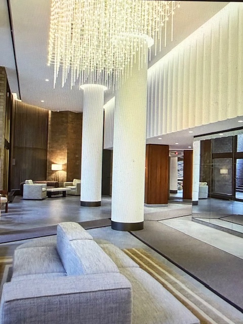 40 East 94th Street, Unit 6F Manhattan, NY 10128 - Photo 14 of 17 a living room with furniture and a large window