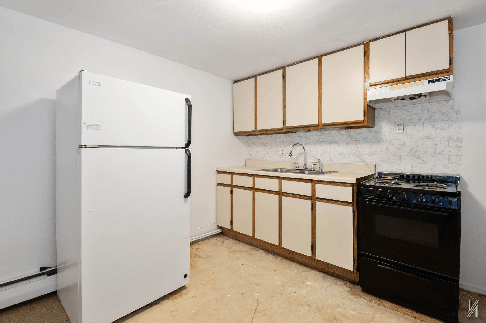 1148 East 73rd Street Brooklyn, NY 11234 - Photo 6 of 15 a kitchen with stainless steel appliances a refrigerator sink and cabinets
