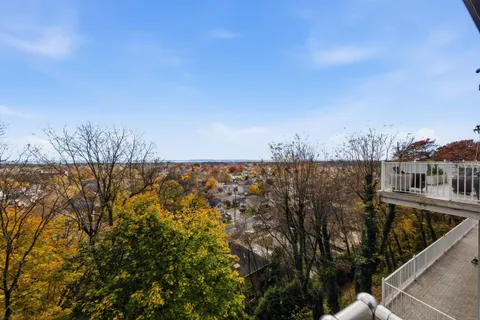 a view of a balcony with city view