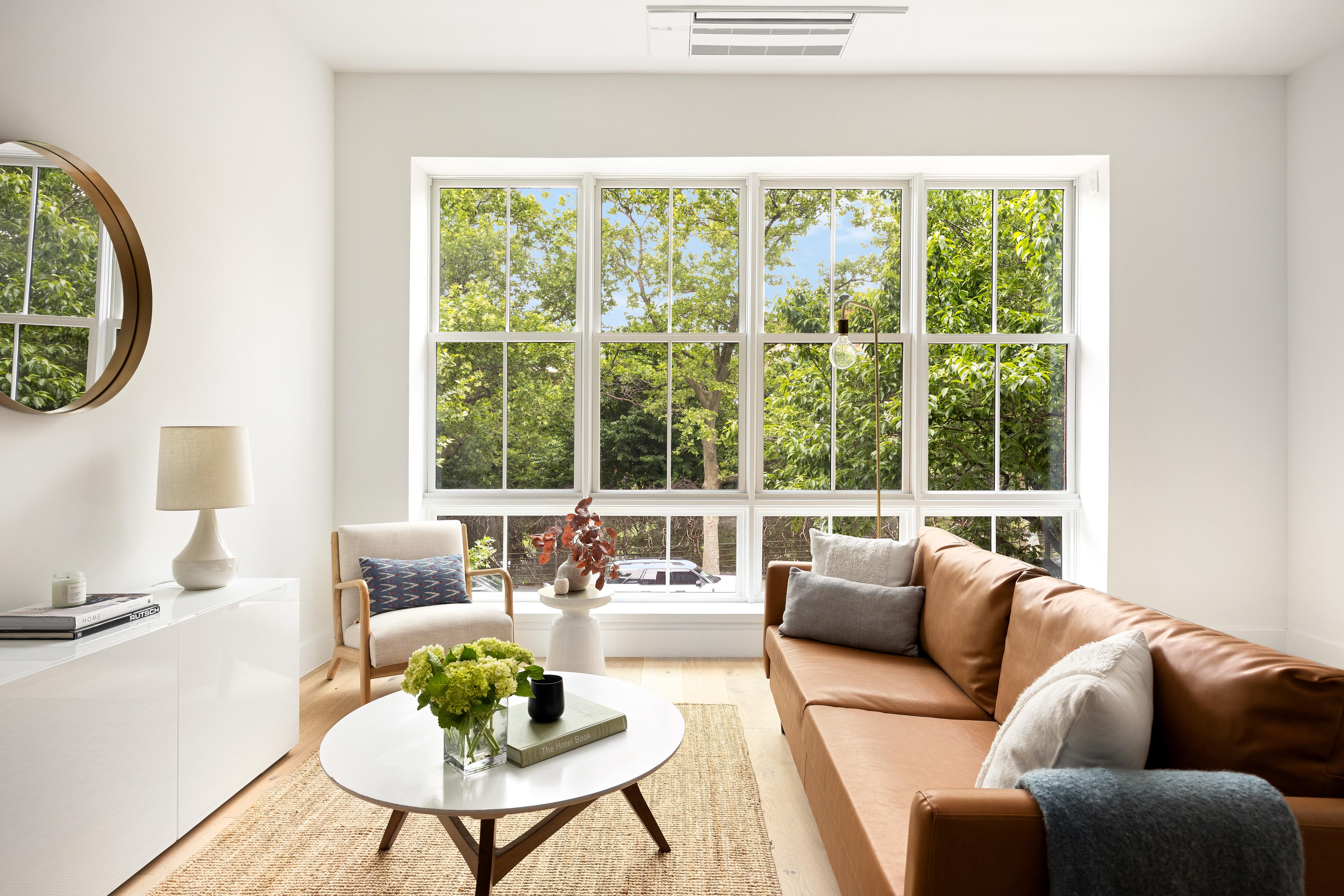 282 17th Street, Unit 2 Brooklyn, NY 11215 - Photo 2 of 11 a living room with furniture and a large window