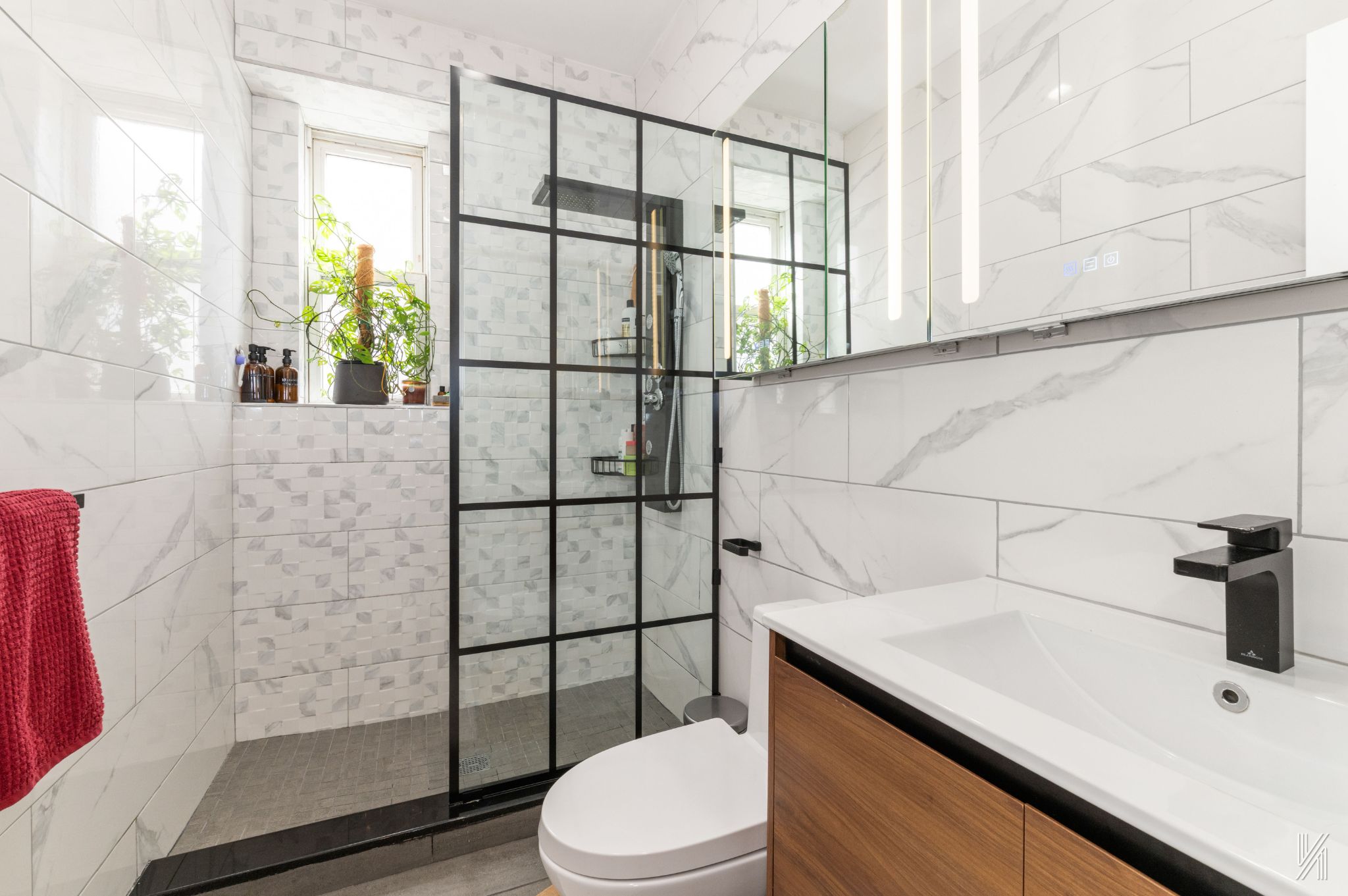 34-39 82nd Street, Unit 52 Queens, NY 11372 - Photo 11 of 18 a bathroom with a sink a toilet and shower