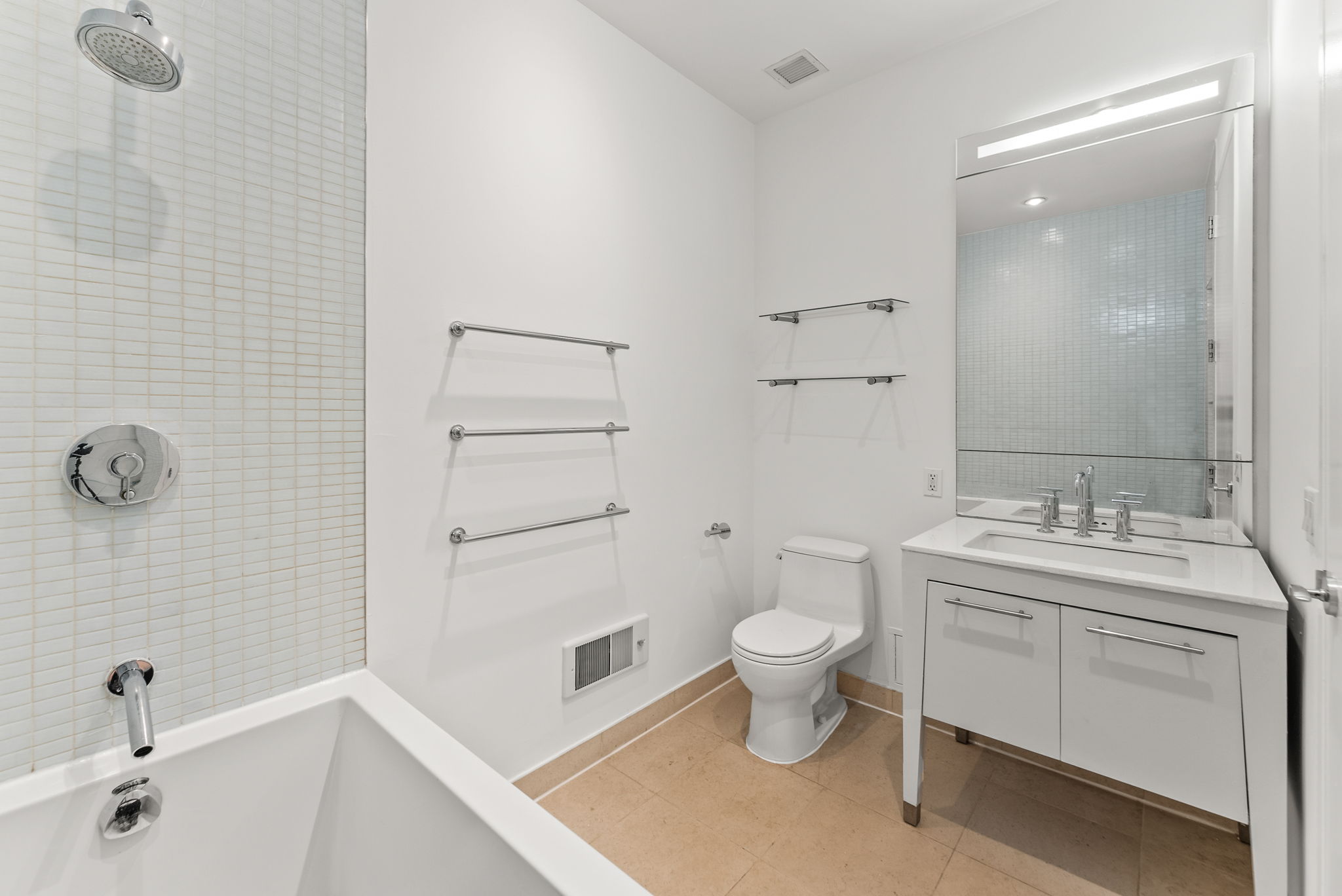 85 Adams Street, Unit 21A Brooklyn, NY 11201 - Photo 11 of 18 a bathroom with a toilet sink and mirror