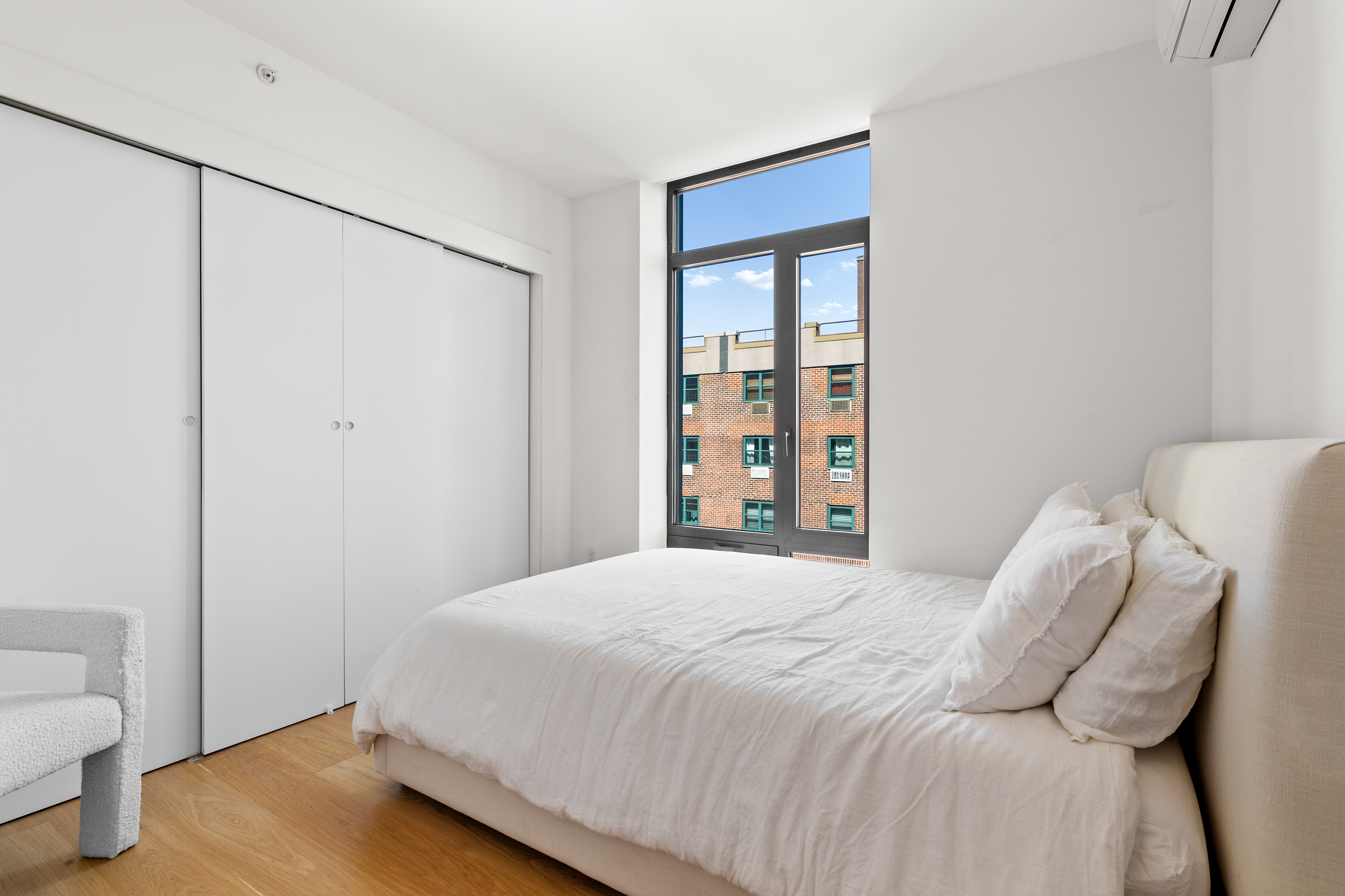 112 Fleet Place, Unit 12A Brooklyn, NY 11201 - Photo 7 of 15 a bedroom with a bed and a window