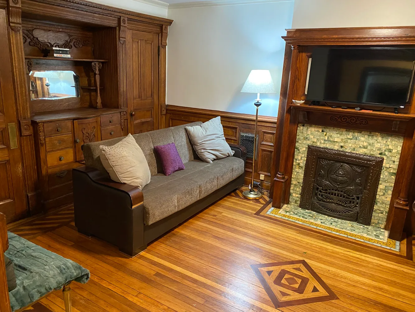 a living room with furniture and a fireplace