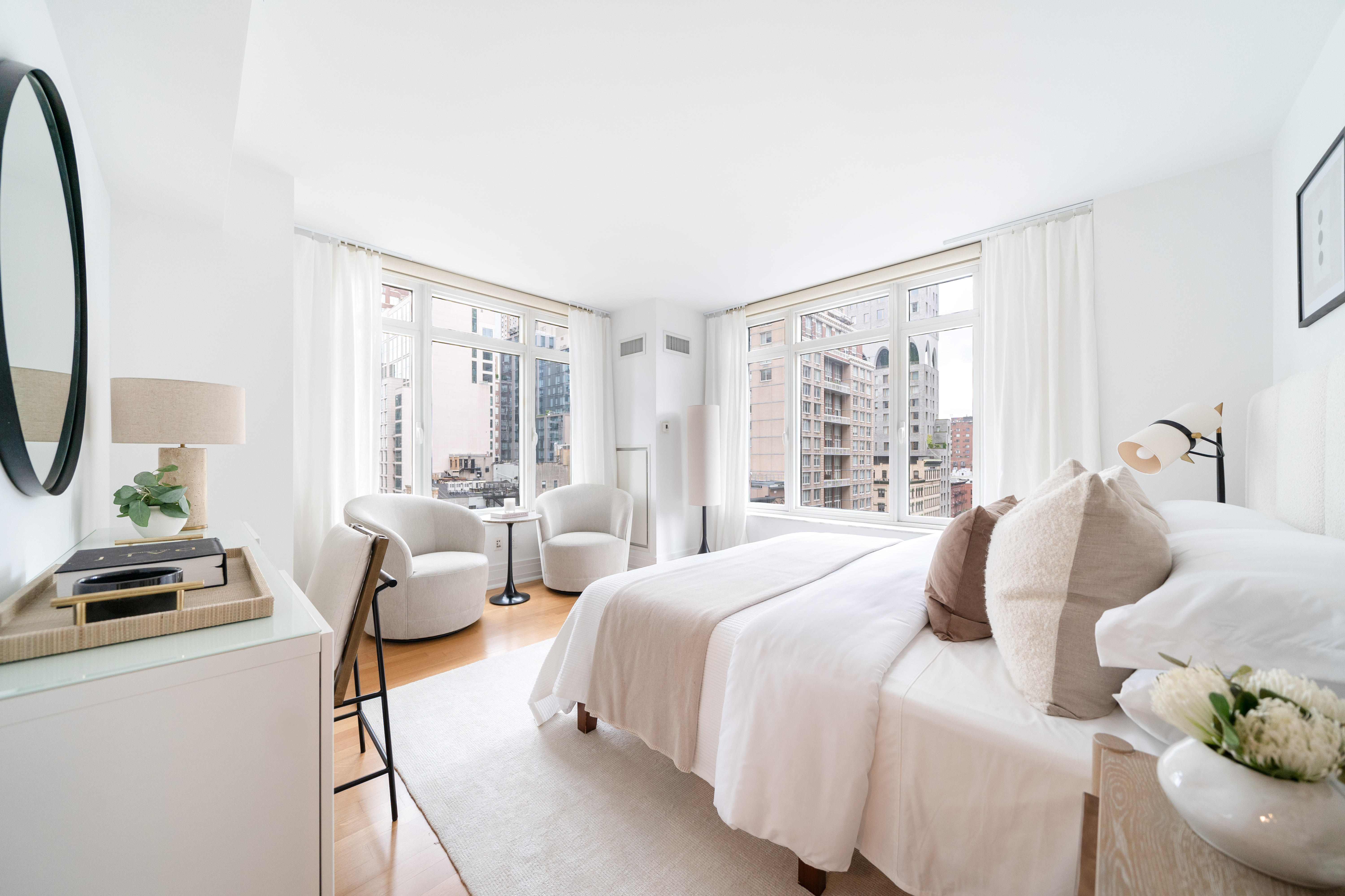 205 East 85th Street, Unit G10 Manhattan, NY 10028 - Photo 10 of 27 a bedroom with furniture and a window