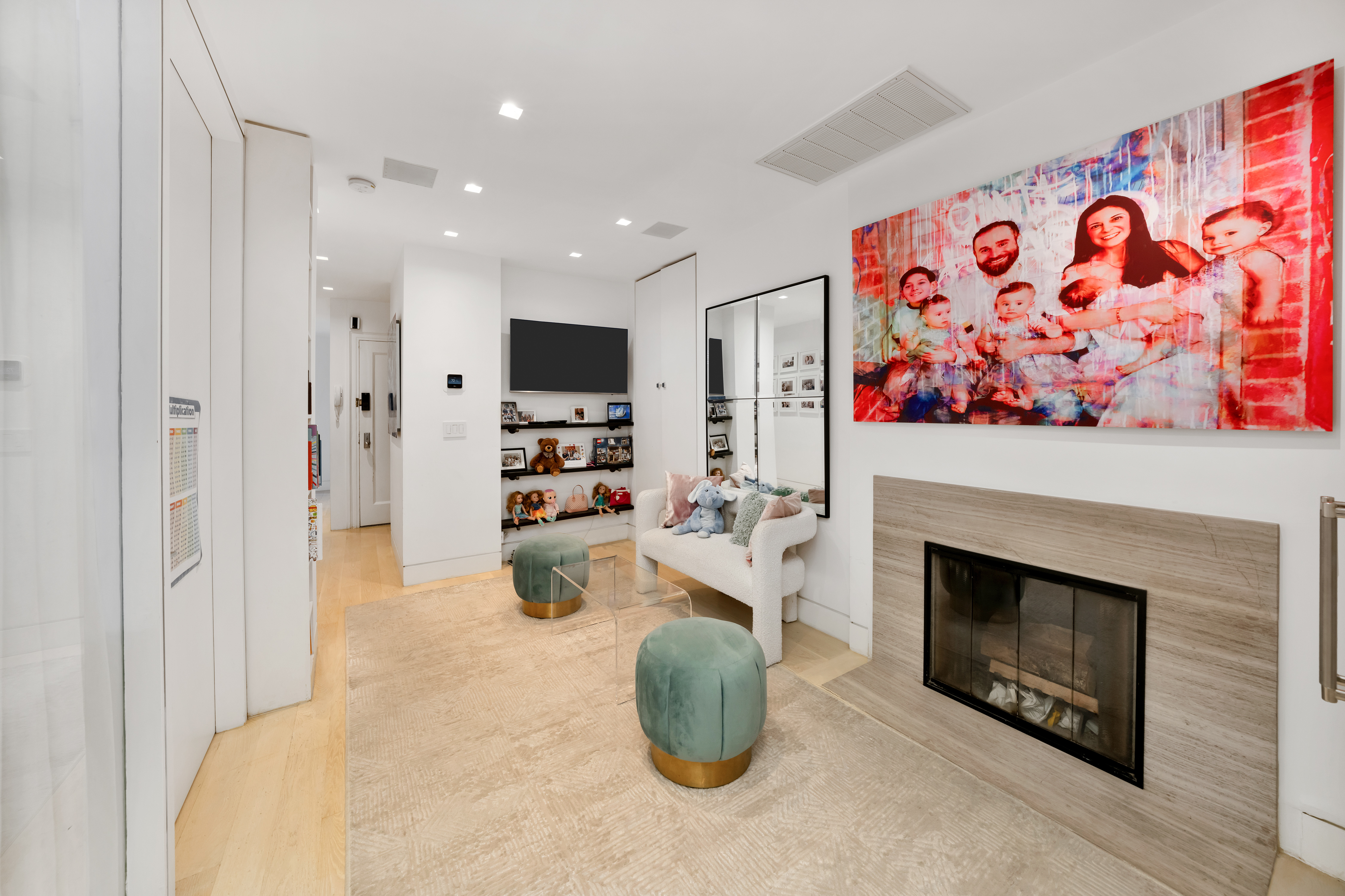 67 Park Avenue, Unit 2BC Manhattan, NY 10016 - Photo 10 of 16 a living room with furniture and a fireplace