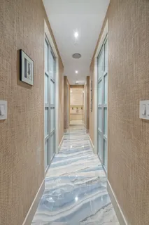 a view of a hallway with a staircase