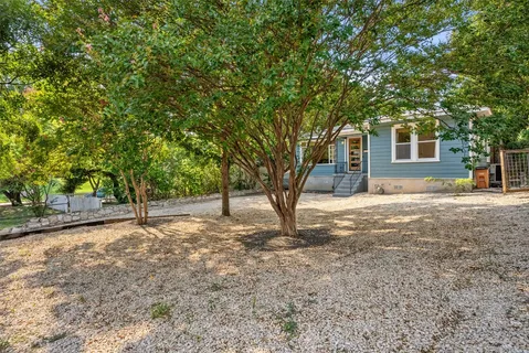 a house with trees in front of it
