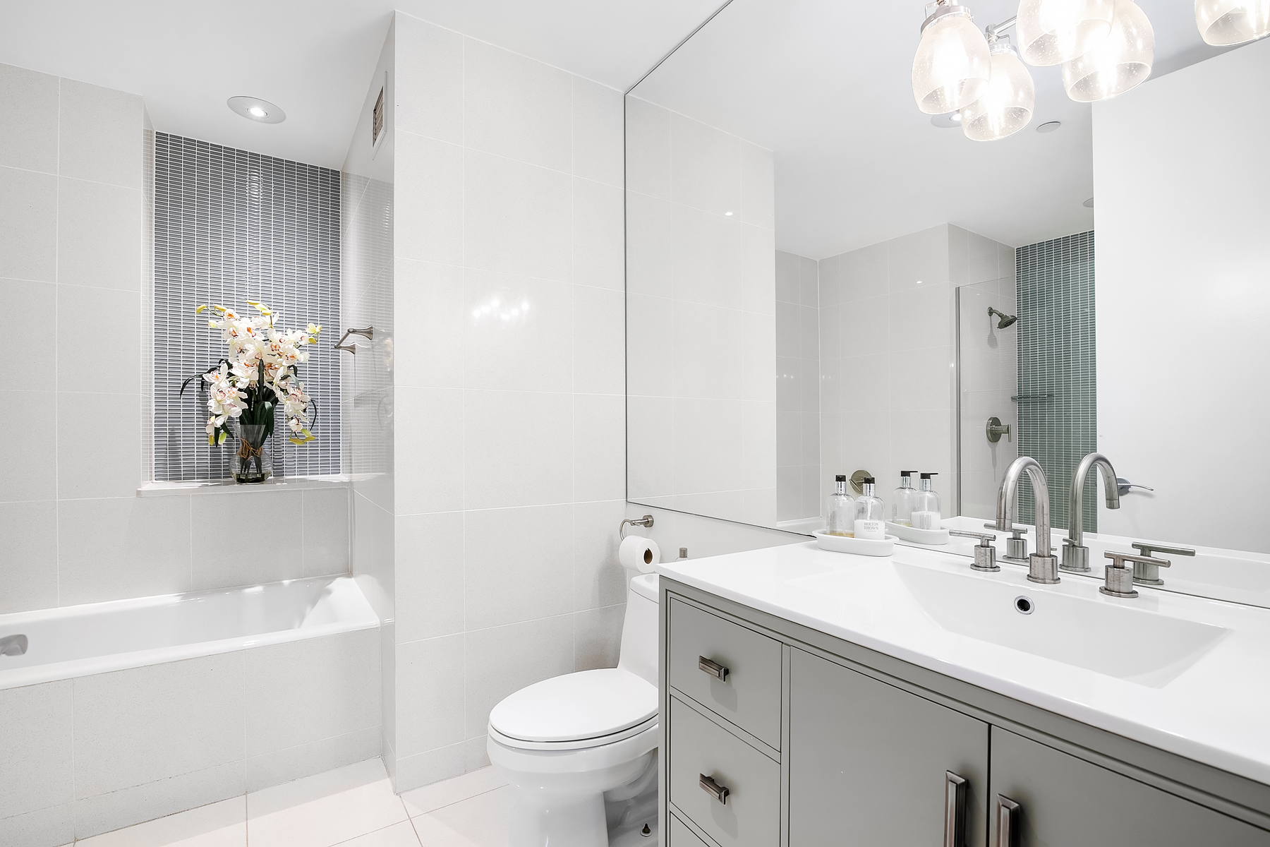32 West 128th Street, Unit 4 Manhattan, NY 10027 - Photo 7 of 11 a bathroom with a sink a toilet and a bathtub