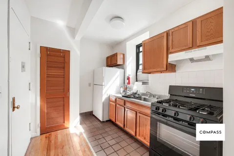 a kitchen with stainless steel appliances a stove and a refrigerator