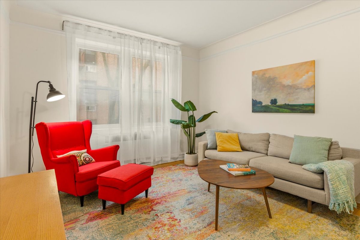 385 Argyle Road, Unit 4A Brooklyn, NY 11218 - Photo 15 of 21 a living room with furniture and a rug