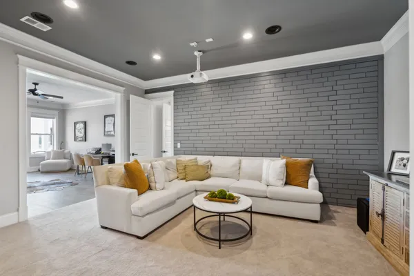 a dining room with furniture and wooden floor