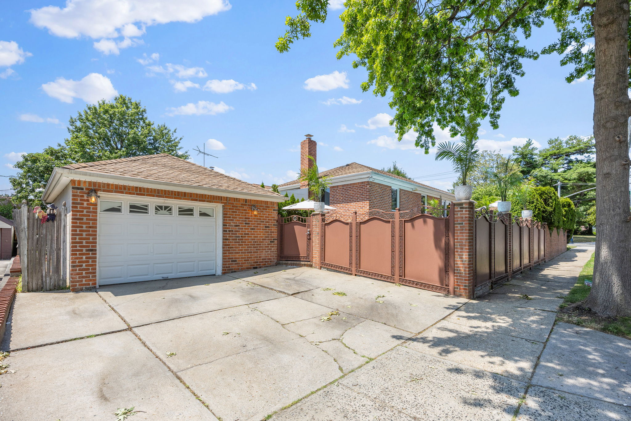 141-18 14th Avenue Queens, NY 11357 - Photo 20 of 26 a front view of a house with a garage