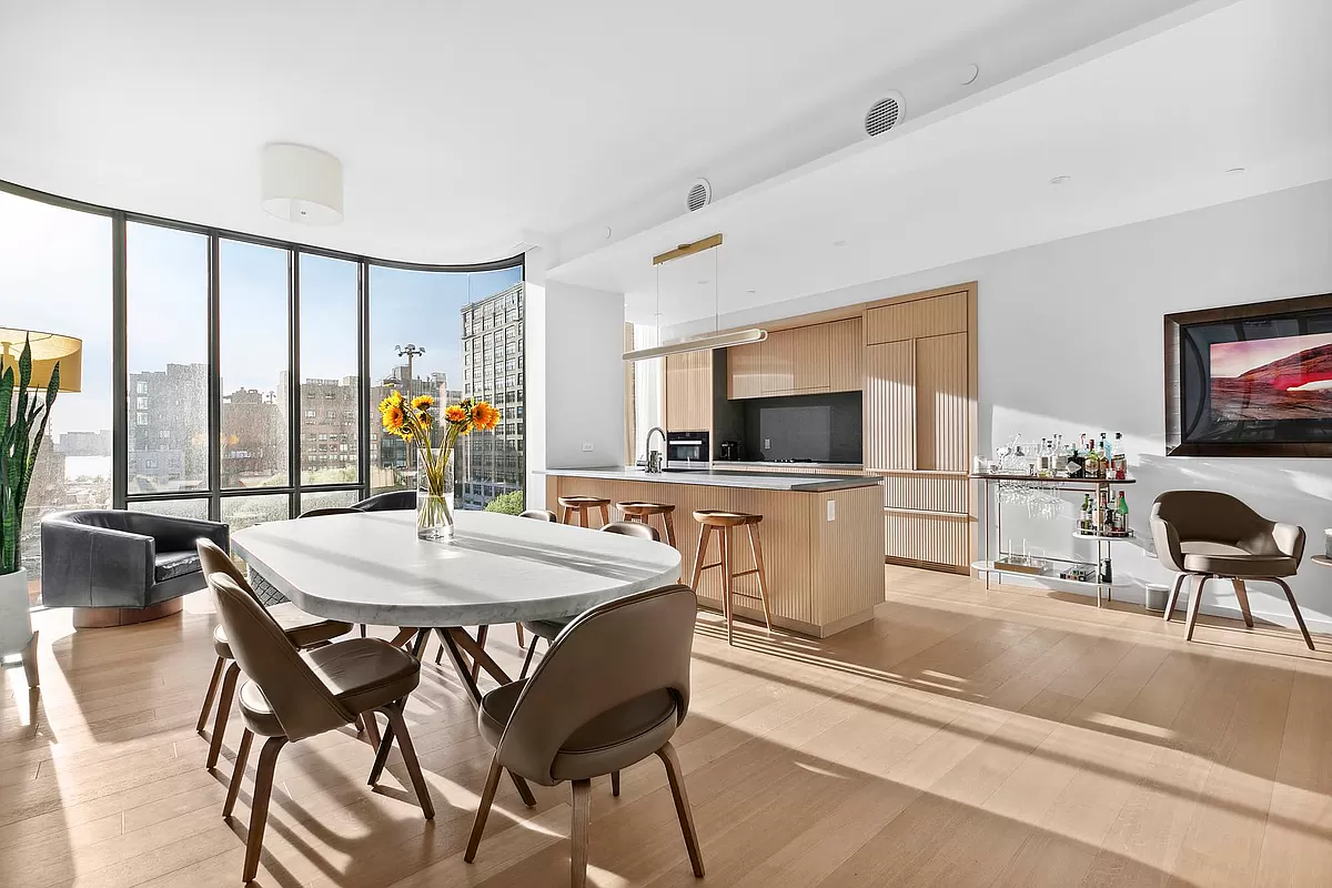 565 Broome Street, Unit S8C Manhattan, NY 10013 - Photo 9 of 24 a view of a dining room with furniture window and wooden floor