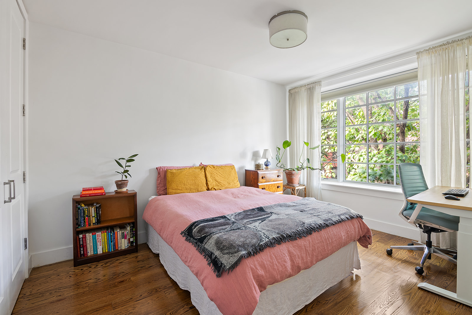 366 Gates Avenue, Unit 3A Brooklyn, NY 11216 - Photo 4 of 8 a bedroom with a bed and a table in it next to a window