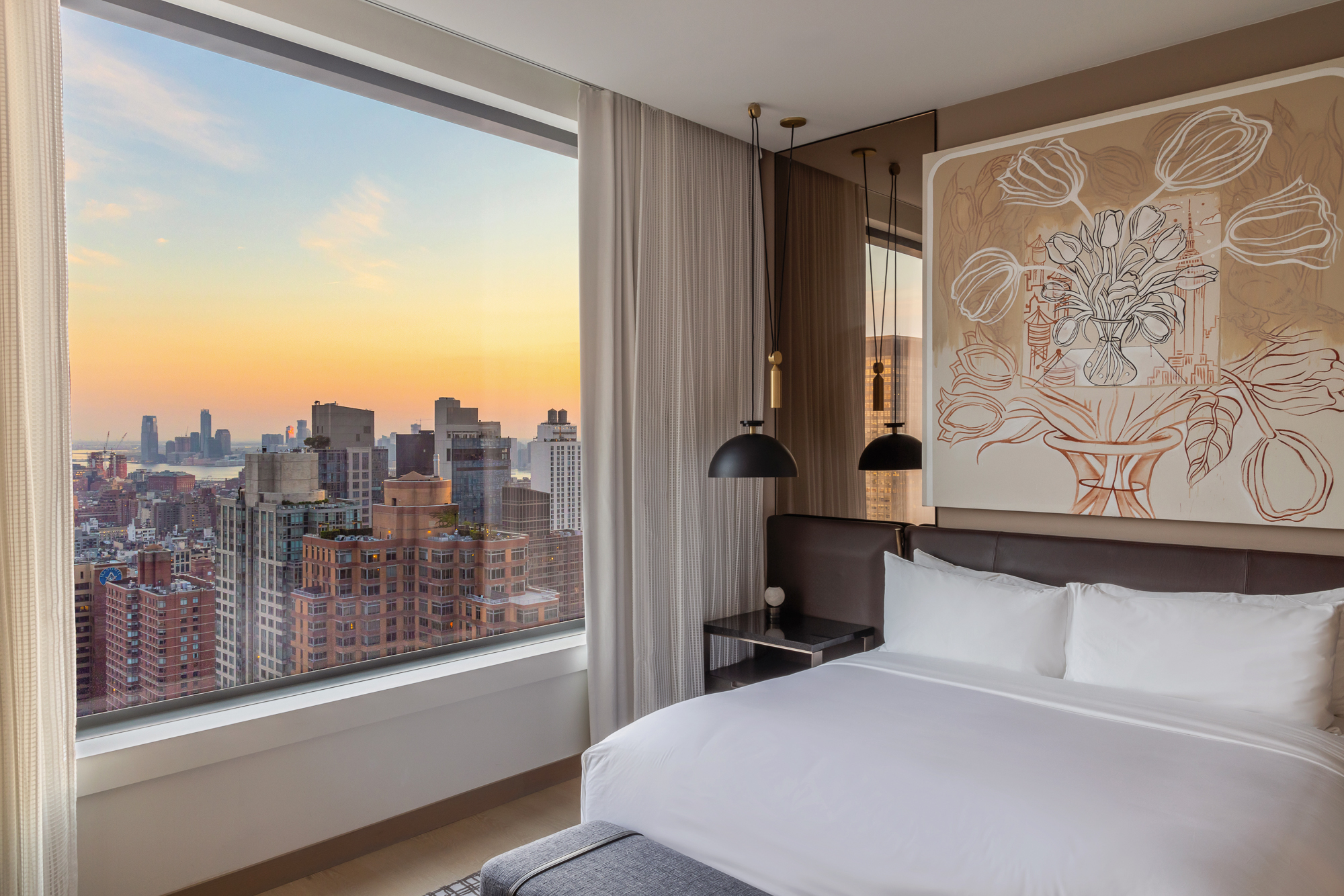 25 West 28th Street, Unit PH42B Manhattan, NY 10001 - Photo 7 of 15 a view of a balcony with wooden floor and a potted plant on a dresser