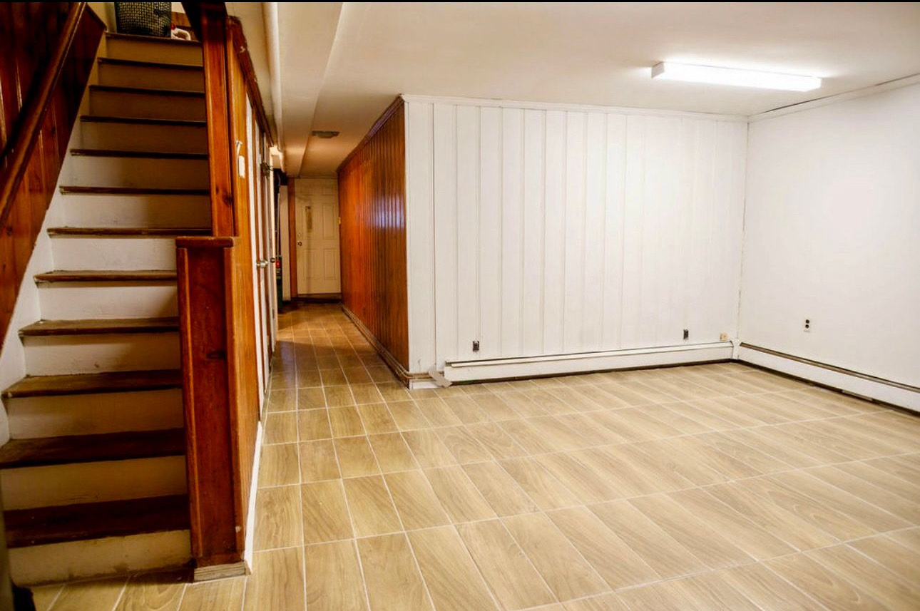 1729 East 54th Street, Unit 1 Brooklyn, NY 11234 - Photo 4 of 6 wooden floor in an empty room