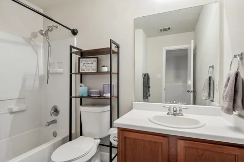 a bedroom with furniture and a window