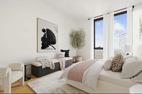 a bedroom with two beds and painting on the wall