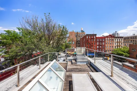 a view of a balcony with city view