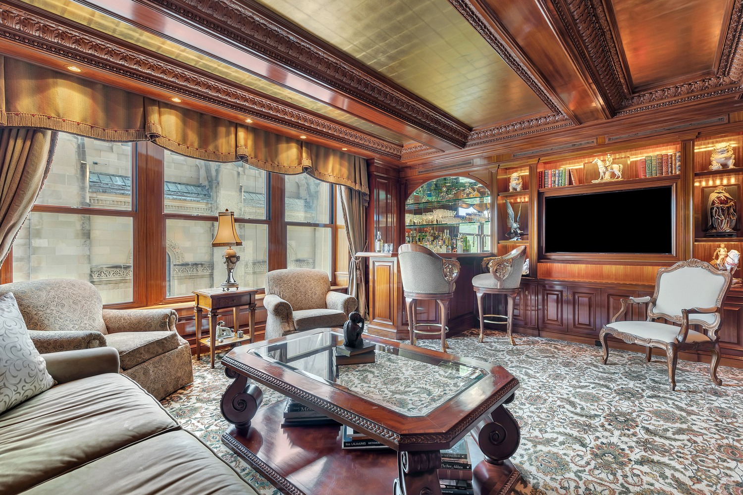 838 5th Avenue, Unit 6 Manhattan, NY 10065 - Photo 9 of 23 a living room with furniture and a flat screen tv