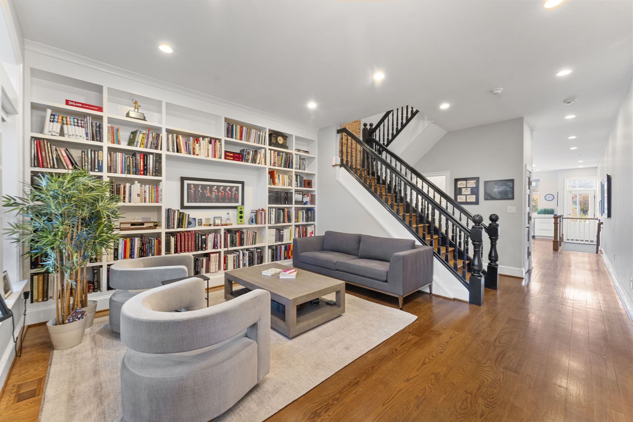 618 3rd Street Northeast Washington, DC 20002 - Photo 3 of 7 a living room with furniture and a book shelf