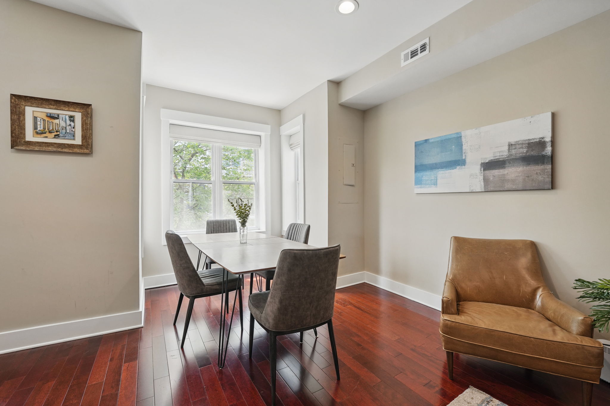 28 Q Street Northeast, Unit 2 Washington, DC 20002 - Photo 8 of 41 a view of a dining room with furniture window and wooden floor