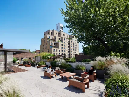a building outdoor space with lots of plants and trees