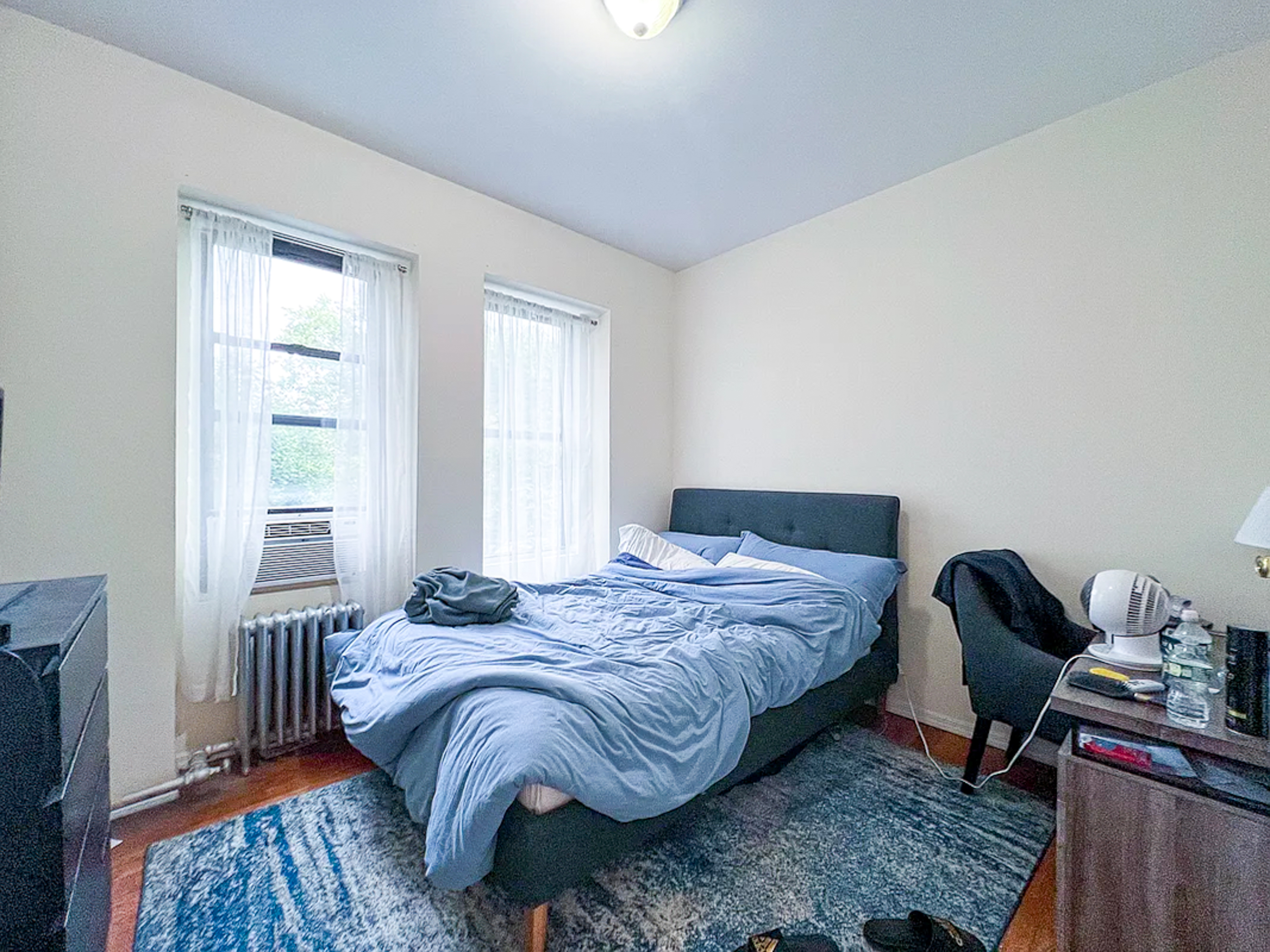 55 East 2nd Street, Unit 7 Manhattan, NY 10003 - Photo 4 of 18 a bedroom with a bed and a window