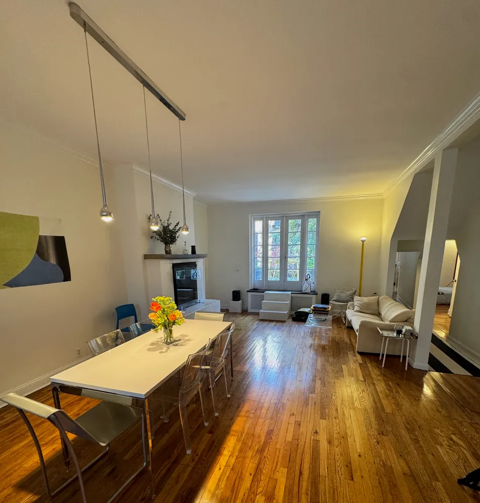 a view of a living room and dining room