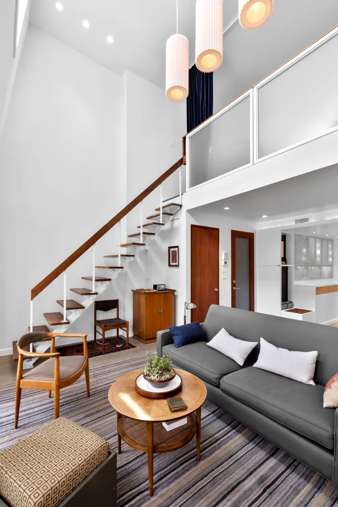a kitchen with sink cabinets and wooden floor