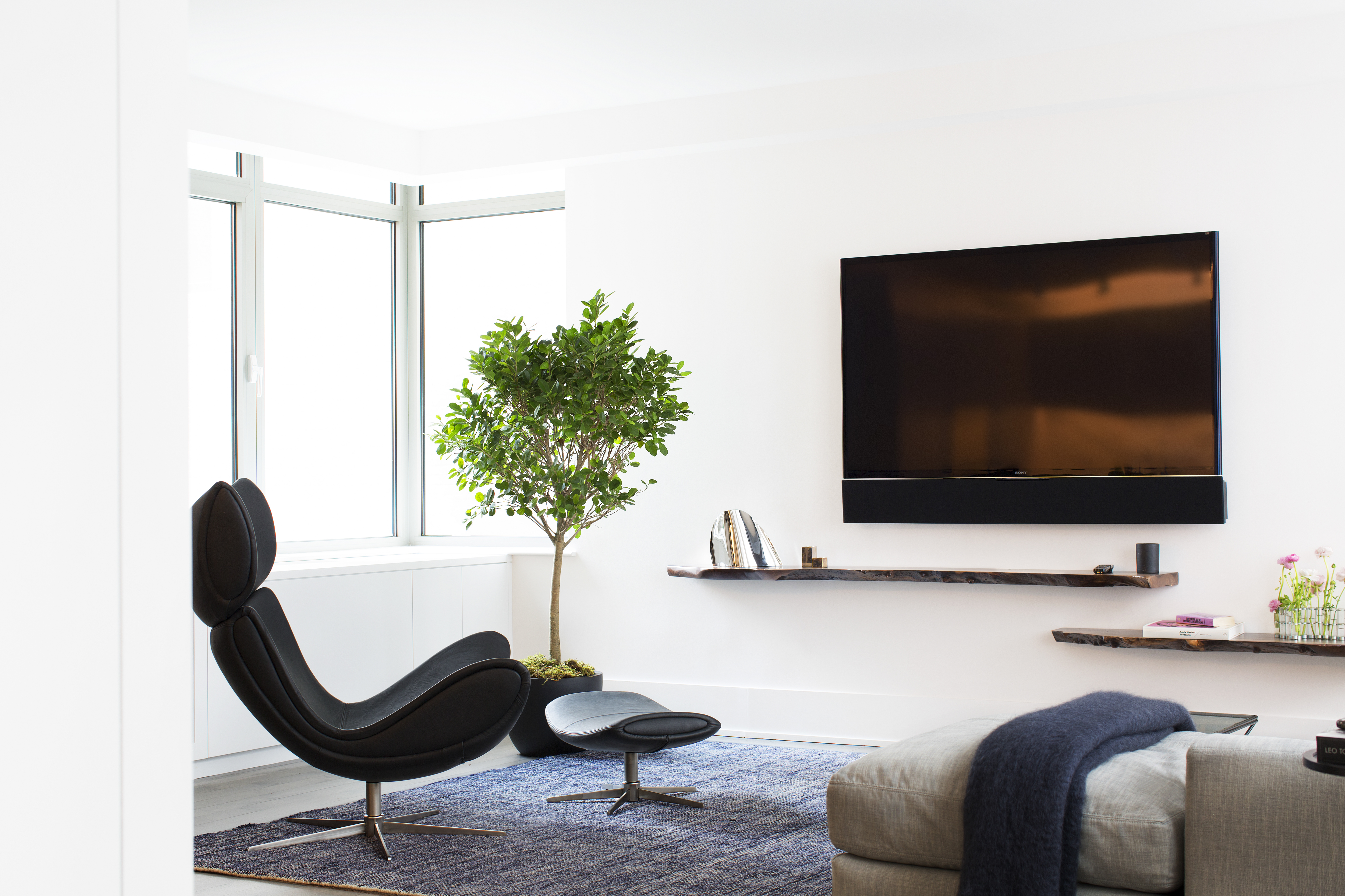 224 West 18th Street, Unit 6C Manhattan, NY 10011 - Photo 3 of 21 a living room with furniture and a flat screen tv