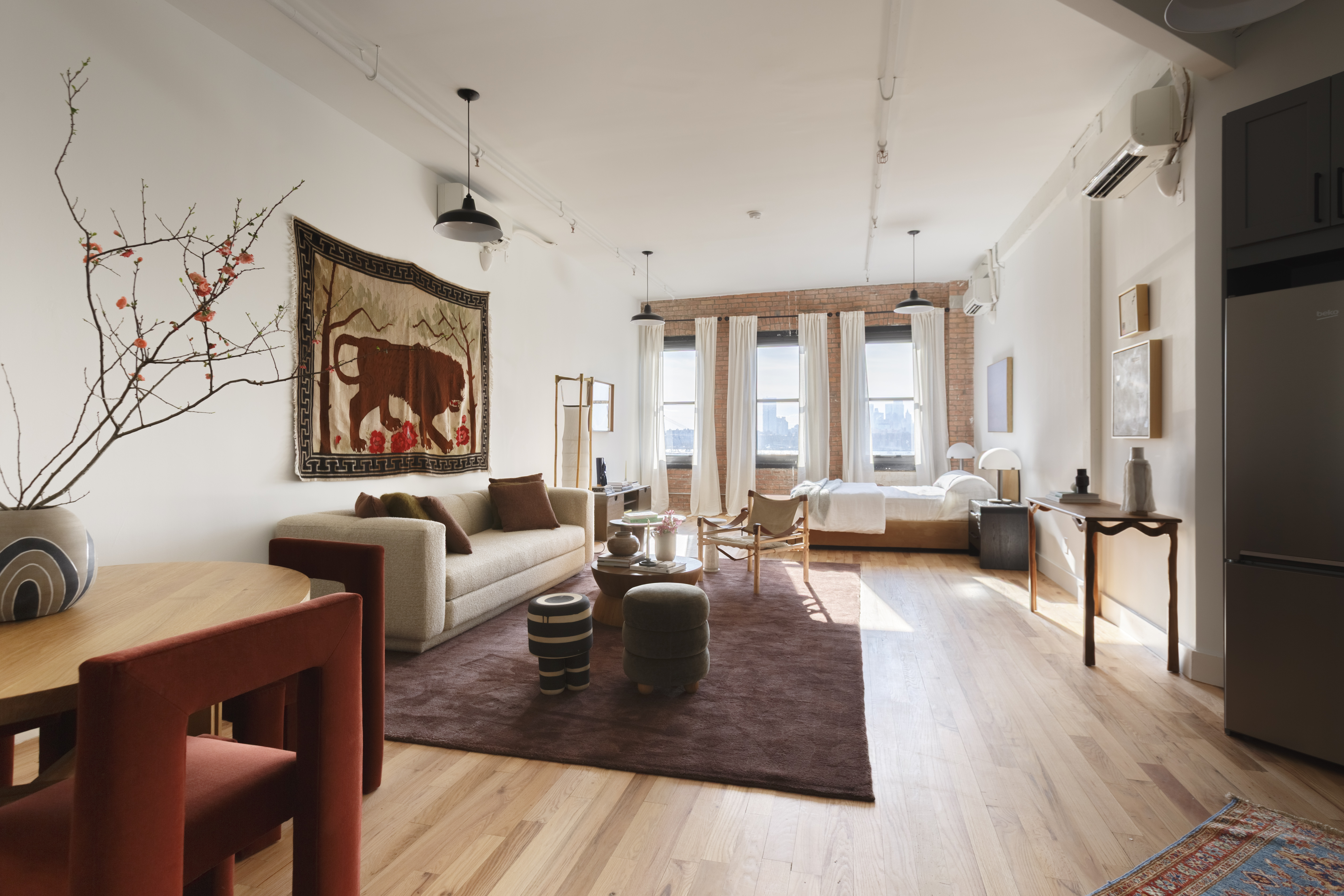 239 Banker Street, Unit 2R Brooklyn, NY 11222 - Photo 2 of 13 a living room with fireplace furniture and a large window