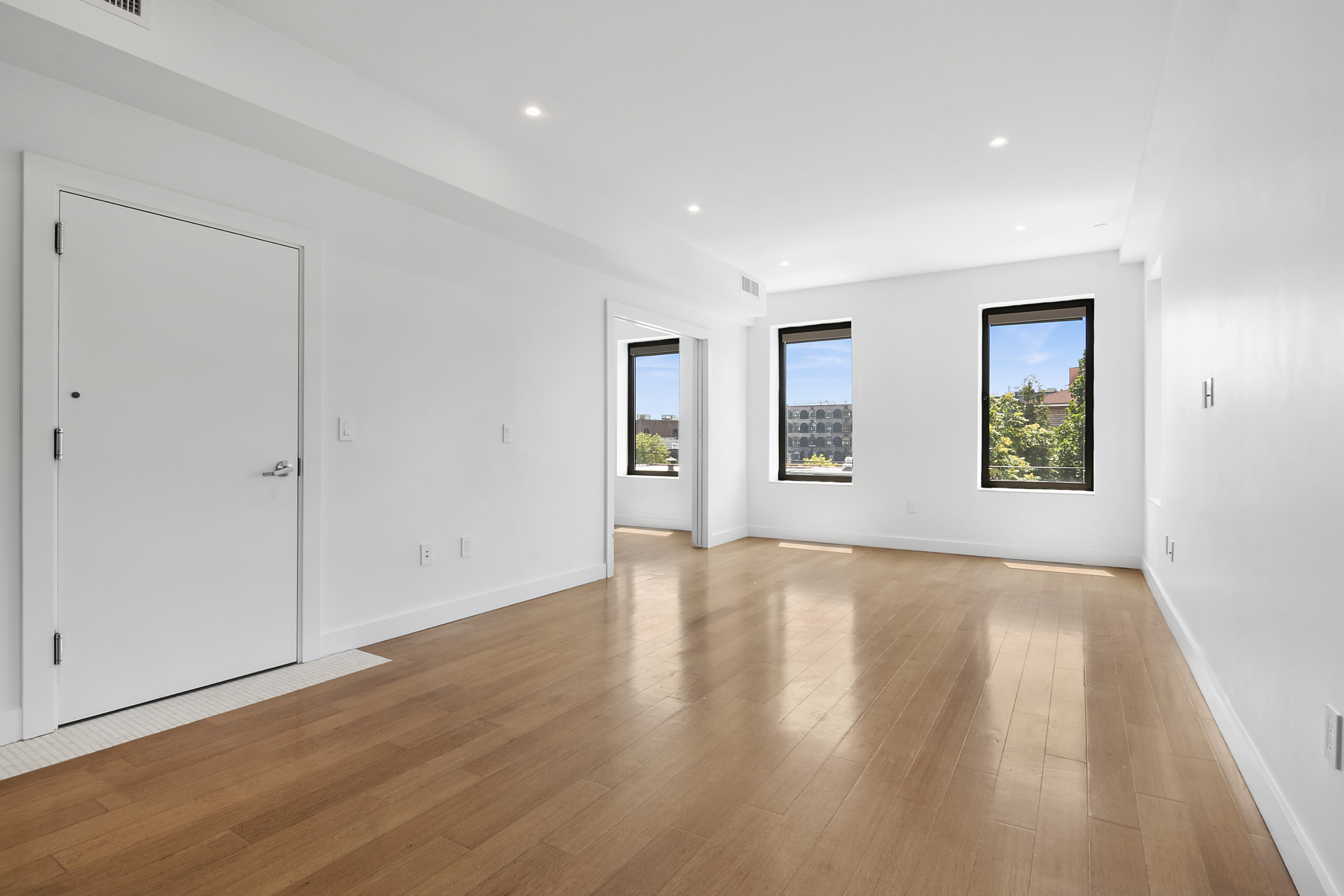 162 Beard Street, Unit 3 Brooklyn, NY 11231 - Photo 4 of 12 a view of an empty room with window and wooden floor