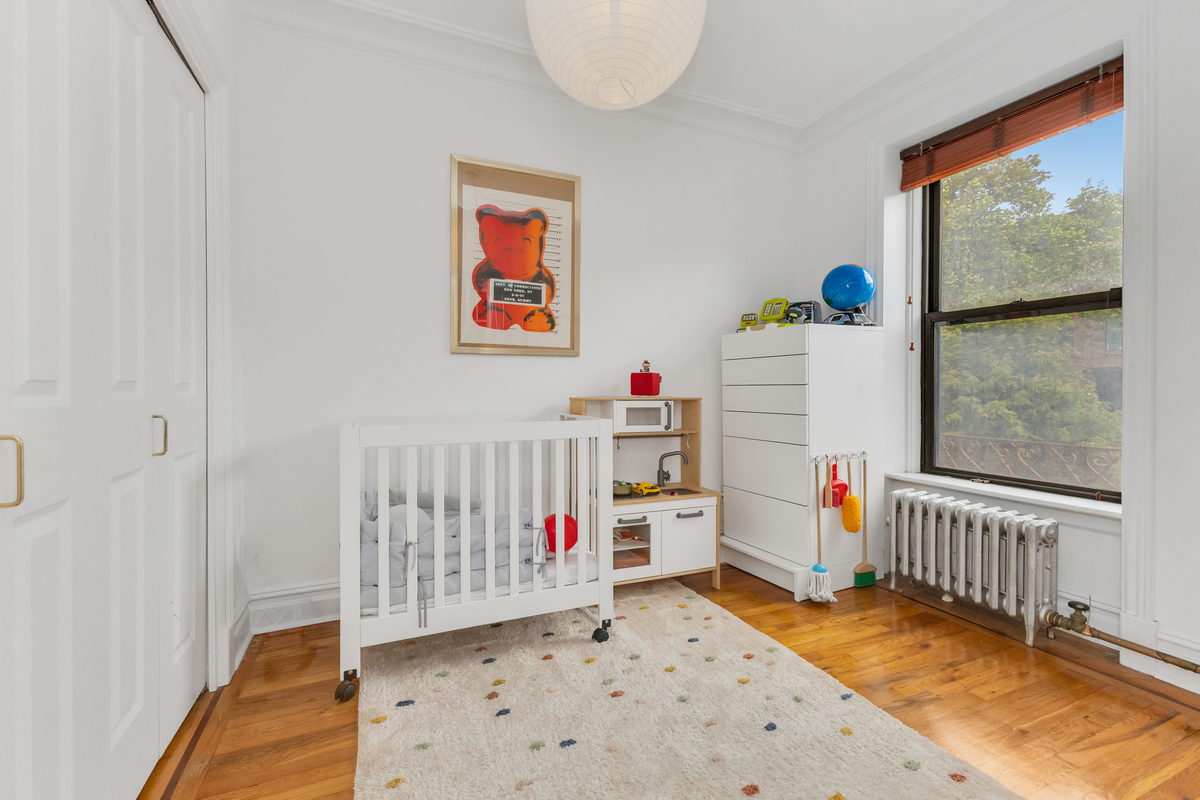 74 2nd Place, Unit 2B Brooklyn, NY 11231 - Photo 7 of 14 a view of a bedroom with baby crib and toys