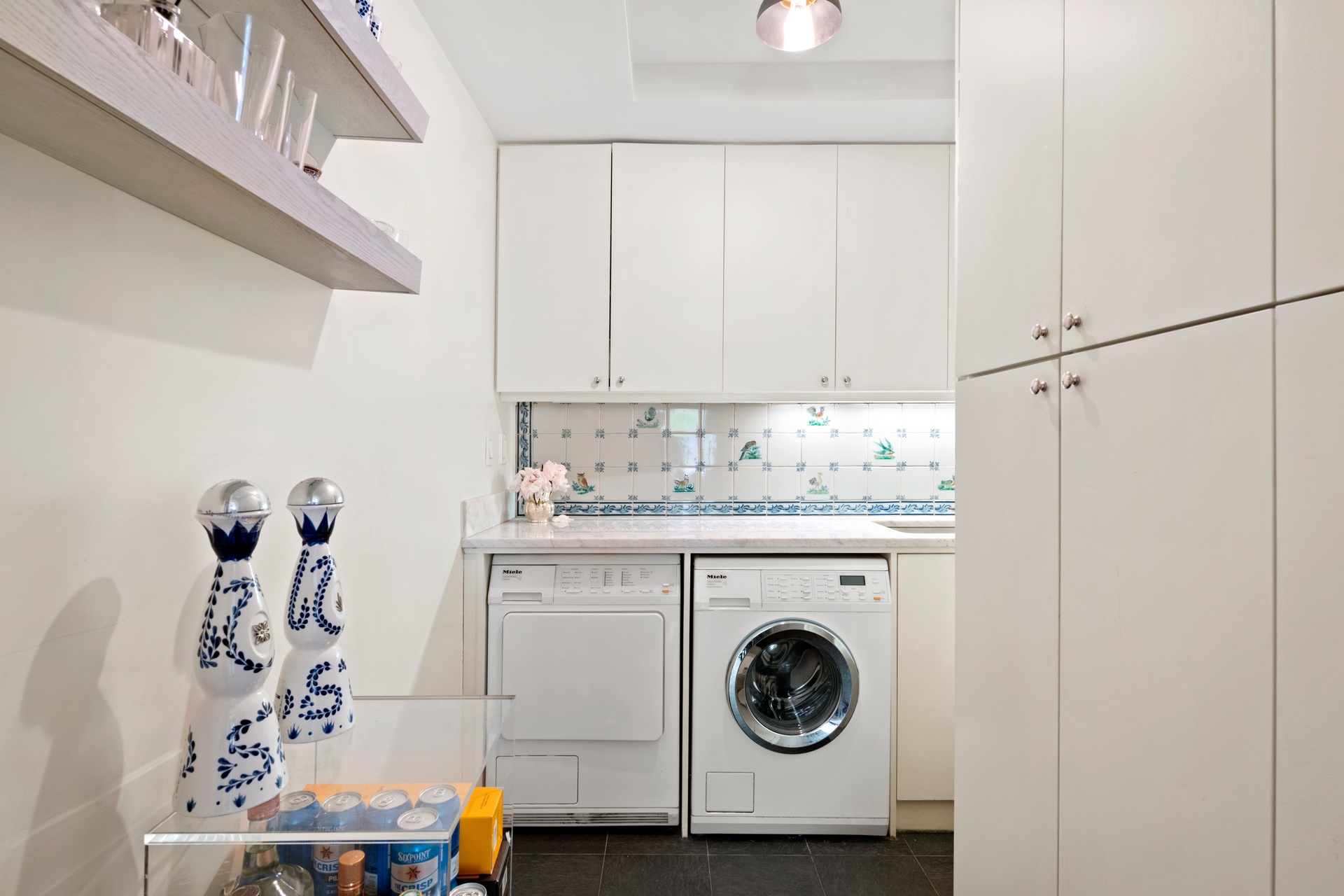 225 East 79th Street, Unit 3A Manhattan, NY 10075 - Photo 8 of 10 a utility room with dryer and washer