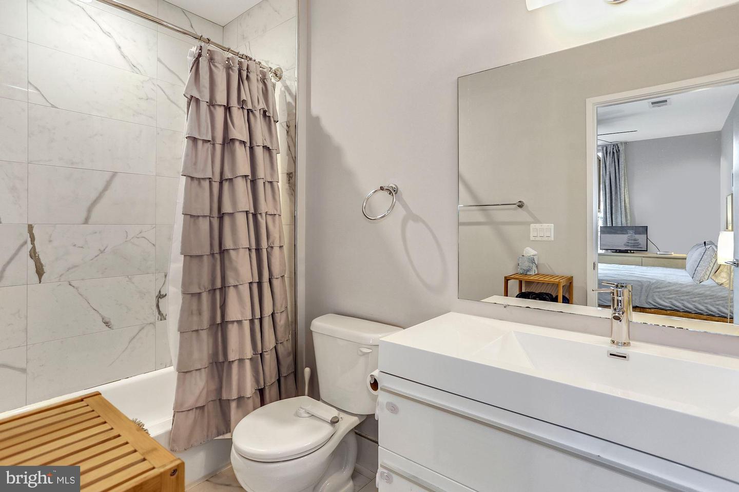 129 Varnum Street Northwest, Unit 6 Washington, DC 20011 - Photo 19 of 25 a bathroom with a sink toilet and shower