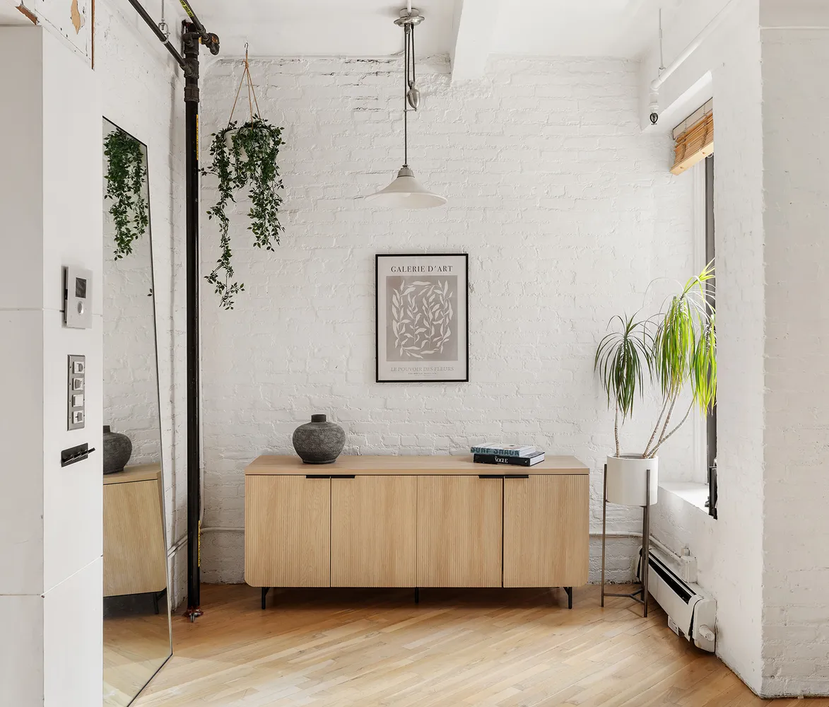 a view of a bathroom with a sink and mirror