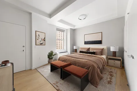 a bedroom with a bed and a couch