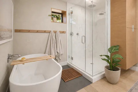 a white bath tub sitting next to a white tub