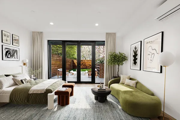 a bedroom with furniture and large windows