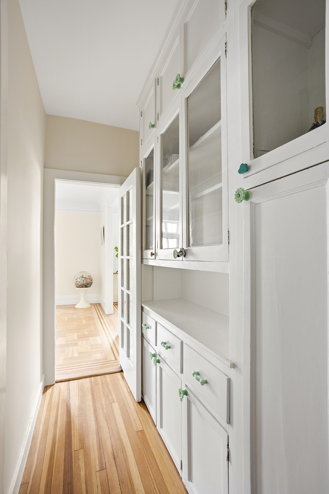 33-39 80th Street, Unit 2A Queens, NY 11372 - Photo 13 of 19 a view of a hallway with wooden floor and staircase